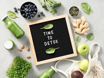 Healthy foods surrounding a sign that reads Time to Detox