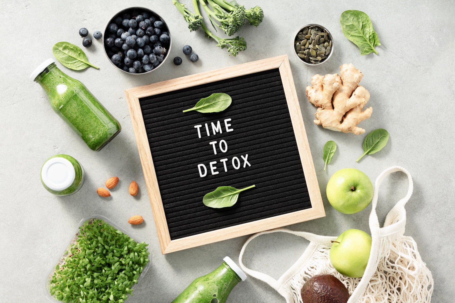 Healthy foods surrounding a sign that reads Time to Detox